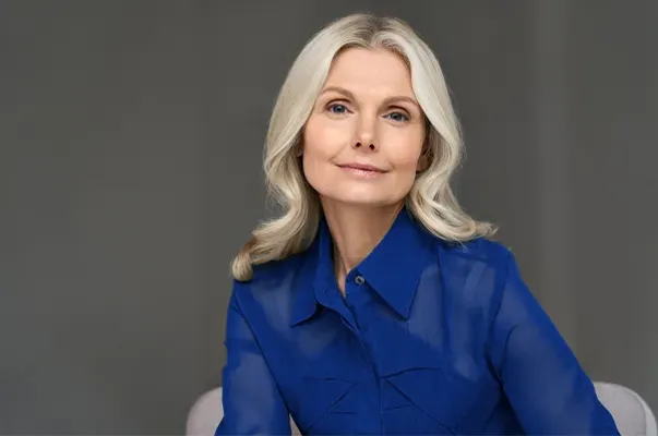 A mature woman with lustrous hair and skin. Get GHK-Cu peptides for skin and hair from Don D. Fisher, D.O. at The BEST Program in Fort Lauderdale.