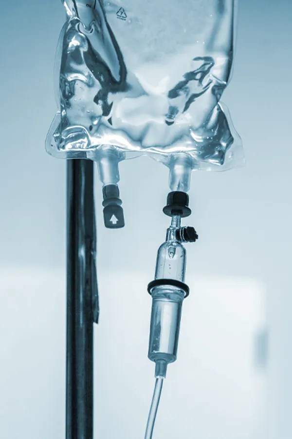 Close-up of an IV bag and drip. Get regenerative exosome IV therapy from Don D. Fisher, D.O. at The BEST Program in Fort Lauderdale.